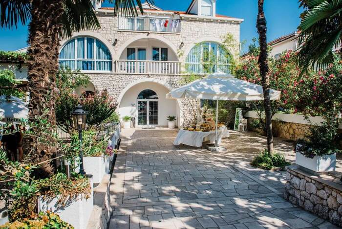 Hotel Metković - stone facade with arched balconies